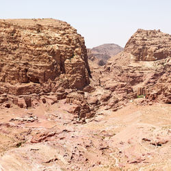 Rock formations on landscape against clear sky