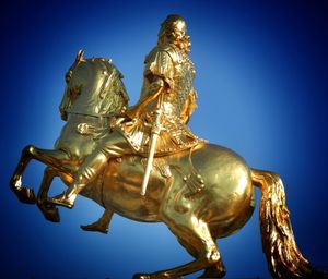 Low angle view of statue against blue sky