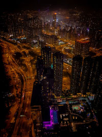 High angle view of illuminated city buildings at night