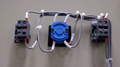Close-up of machine part hanging on wall