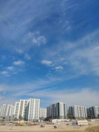 Buildings in city against sky