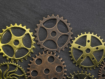 Close-up of gears on black table