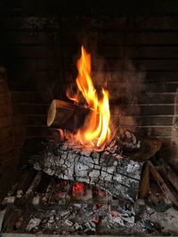 Bonfire on wooden log at night