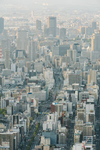 High angle view of buildings in city against sky