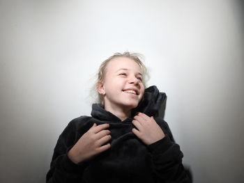 Smiling girl against white background