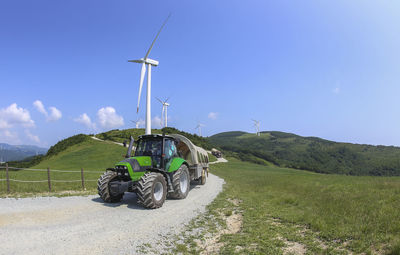 Tractor on field against sky