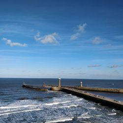 Scenic view of sea against blue sky