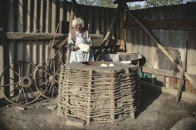 Portrait of woman working in basket
