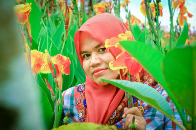 Portrait of woman with plants