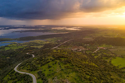 Alentejo drone aerial view of the landscape at sunset with alqueva dam reservoir, in portugal