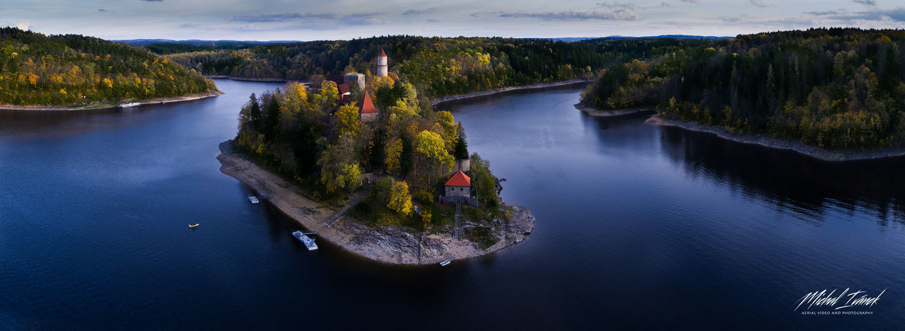 HIGH ANGLE VIEW OF WATERFALL BY RIVER