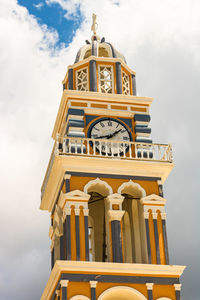 Low angle view of clock tower against sky