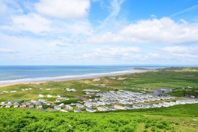 Panoramic view of townscape by sea against sky