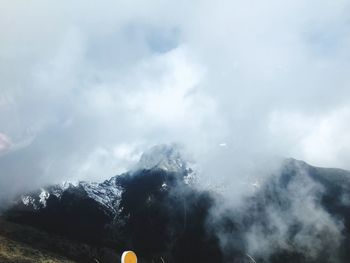 Scenic view of mountains against sky during winter