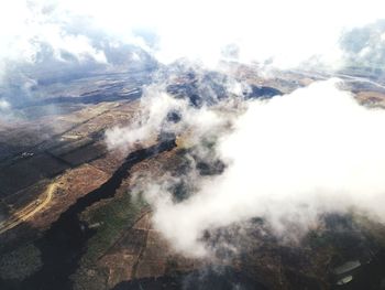 Smoke emitting from volcanic mountain against sky