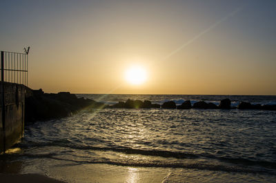 Scenic view of sea against sky during sunset
