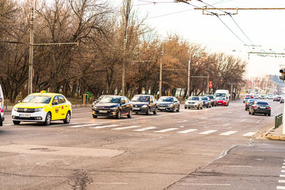 Cars on road against sky