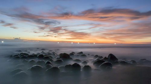 Scenic view of sea against sky during sunset