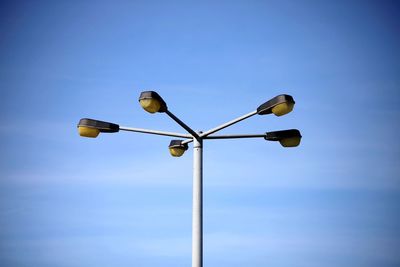 Low angle view of street light against sky