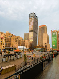 Panoramic view of city buildings against sky