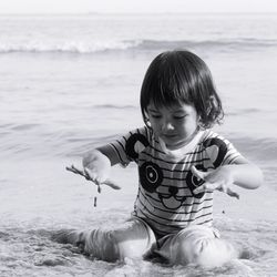 Cute boy playing on beach