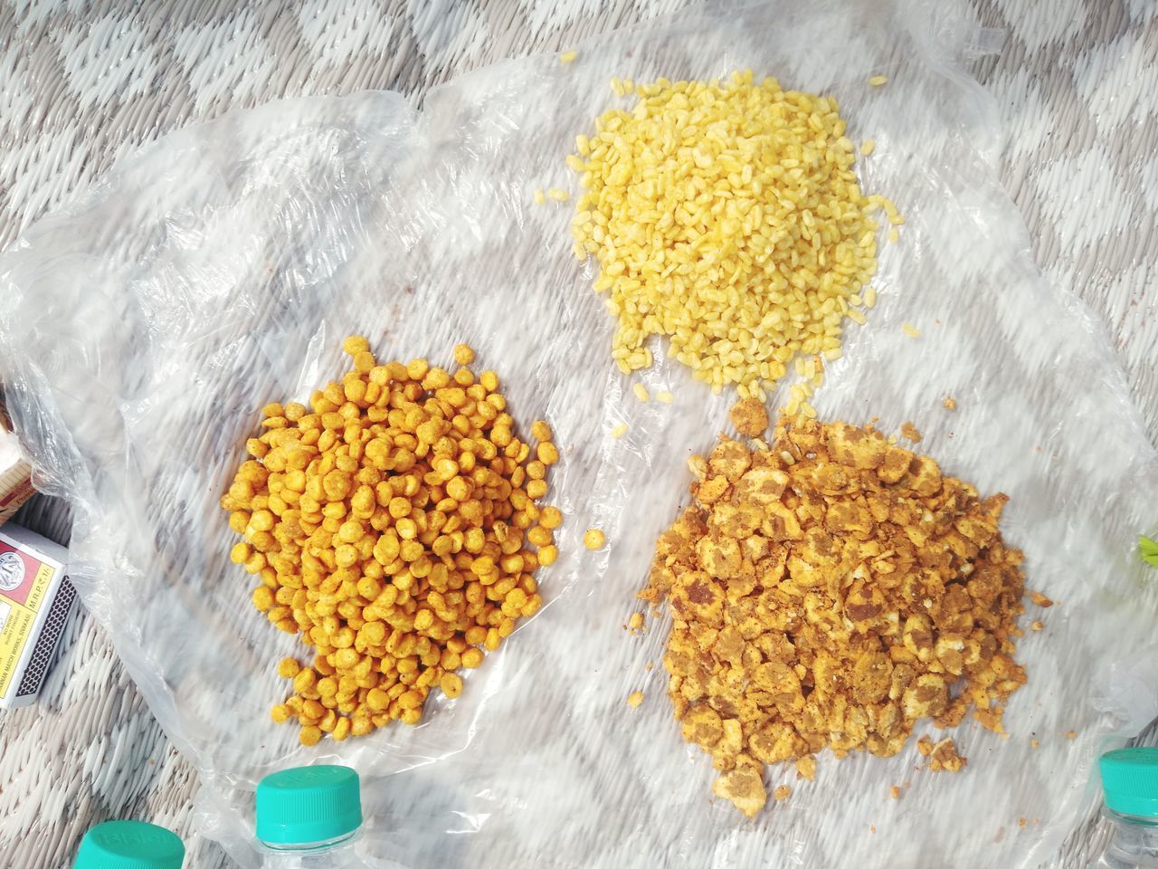 HIGH ANGLE VIEW OF YELLOW MARIGOLD FLOWERS IN CONTAINER ON FLOOR