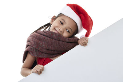 Portrait of boy wearing hat against white background