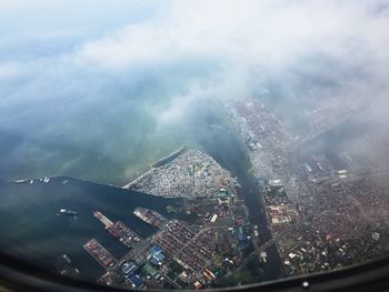 Aerial view of cityscape against sky