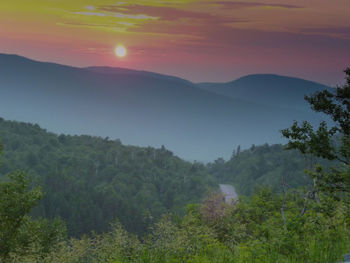 Scenic view of mountains against sky during sunset