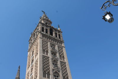 Low angle view of building against blue sky