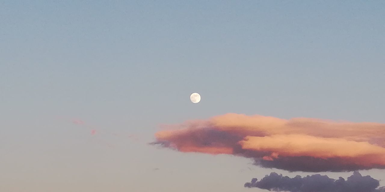 LOW ANGLE VIEW OF MOON AT SUNSET