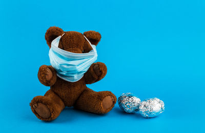 Close-up of stuffed toy against blue background