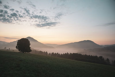 Scenic view of landscape against sky during sunset