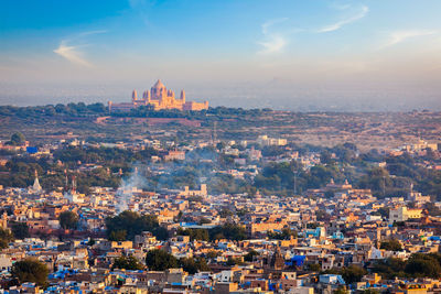 Aerial view of city against sky