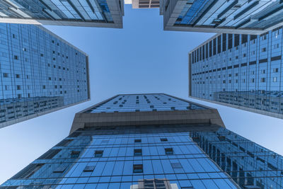 Low angle view of modern buildings against clear sky