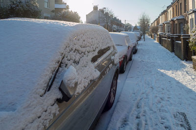 Panoramic view of cars on snow