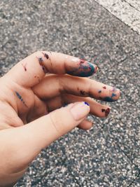 Close-up of stained hand