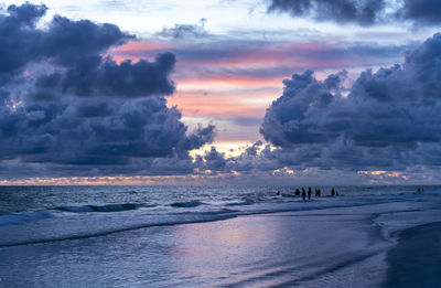 Scenic view of beach against sky during sunset