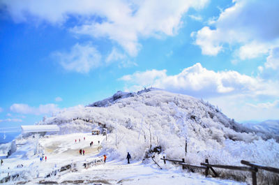 Panoramic view of ski lift against sky