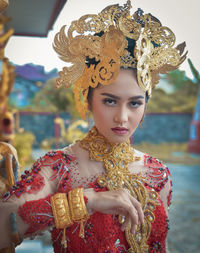 Portrait of young woman in traditional clothing