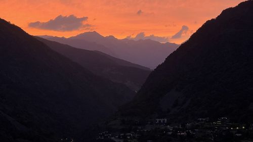 Scenic view of mountains against sky during sunset