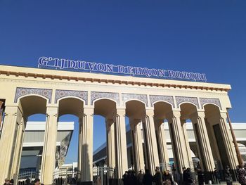 Low angle view of historical building against blue sky