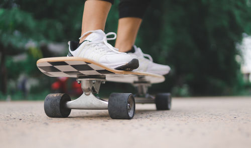 Low section of man skateboarding on skateboard