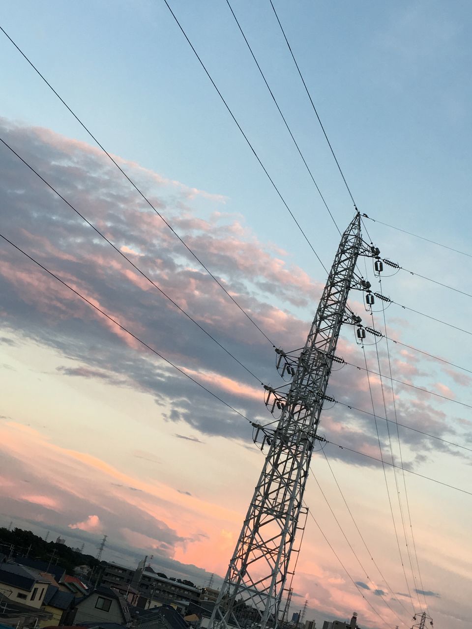 LOW ANGLE VIEW OF ELECTRICITY PYLON AGAINST SKY AT DUSK