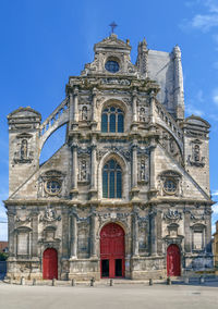 Low angle view of building against blue sky