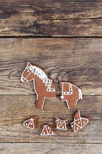 Directly above shot of gingerbread cookie on wooden table