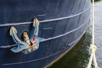 The anchor of an old wooden boat 