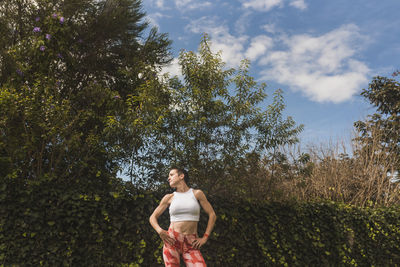 Woman training and stretching outdoors