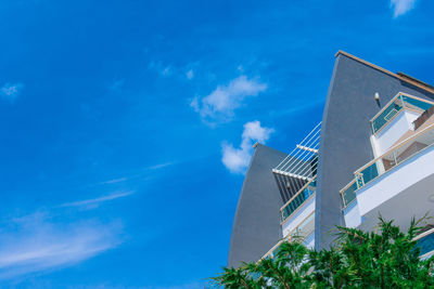 Low angle view of building against blue sky