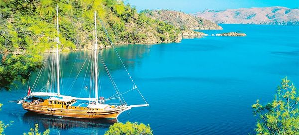 Sailboat sailing on sea against sky